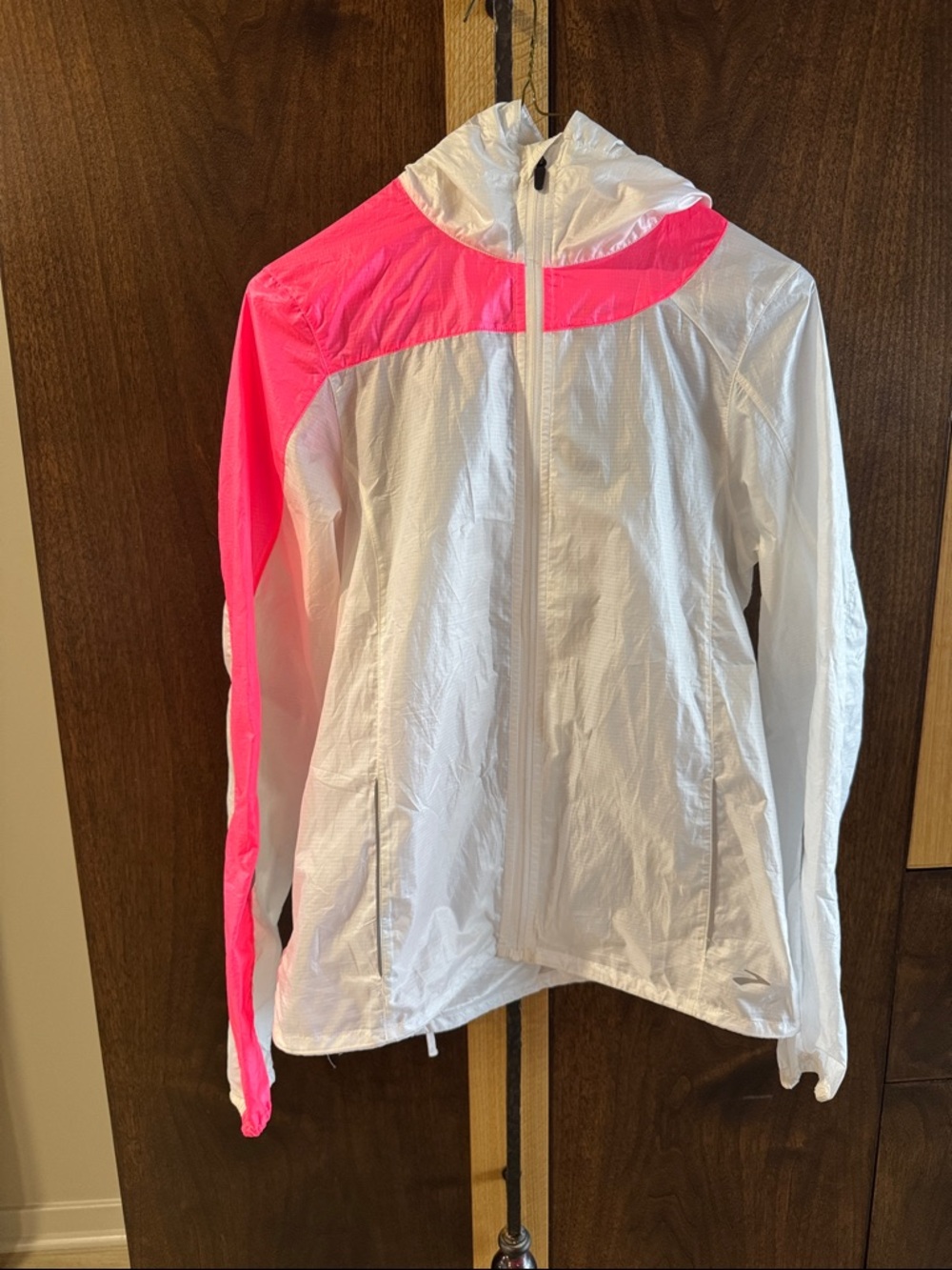 Brooks super light  running jacket. Back zipper pocket for key or fob.
